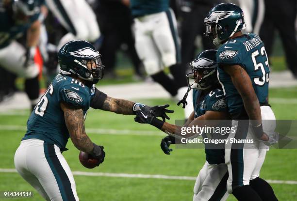 Derek Barnett of the Philadelphia Eagles celebrates recovering a fumble with Patrick Robinson and Nigel Bradham during the fourth quarter against the...