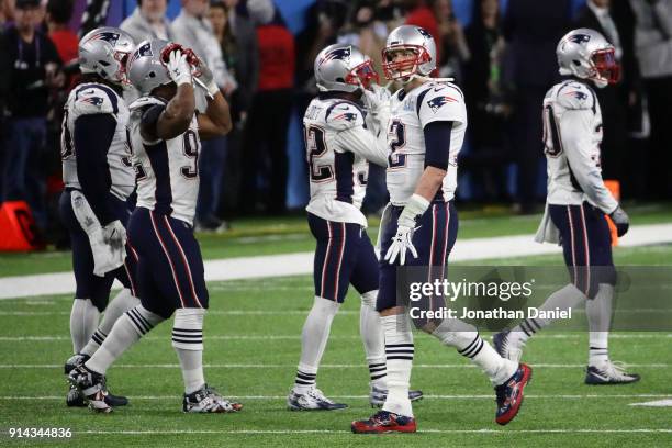 Tom Brady of the New England Patriots and teammates react after having the ball stripped by Brandon Graham of the Philadelphia Eagles late in the...