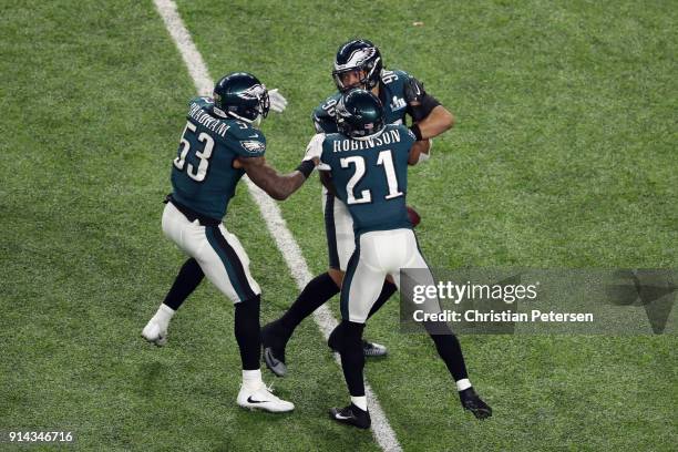 Derek Barnett of the Philadelphia Eagles recovers the ball after teammate Brandon Graham stripped it from Tom Brady of the New England Patriots late...