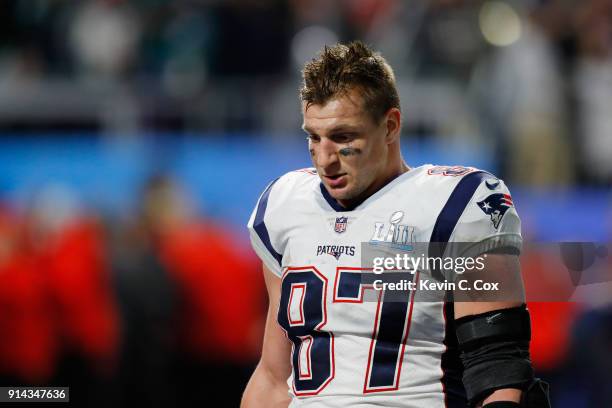 Rob Gronkowski of the New England Patriots walks off the field after his teams 41-33 loss to the Philadelphia Eagles in Super Bowl LII at U.S. Bank...