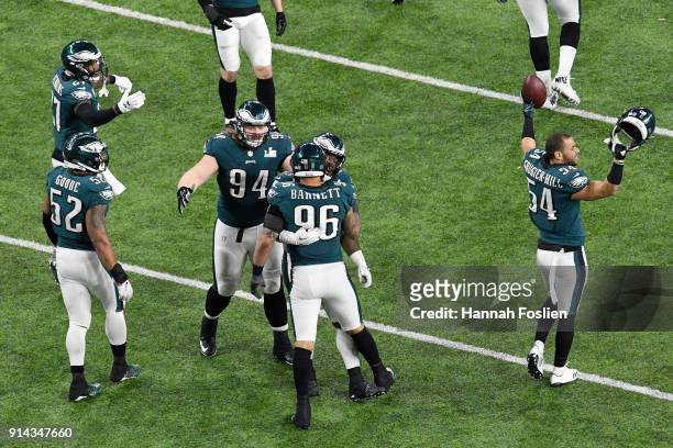 Derek Barnett of the Philadelphia Eagles celebrates with teammates after a fumble by Tom Brady of the New England Patriots during the fourth quarter...