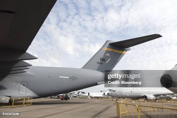 An United States Air Force C-17 Globemaster III aircraft, manufactured by Boeing Co., stands on display at the Singapore Airshow held at the Changi...