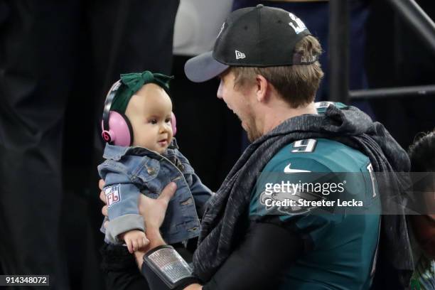 Nick Foles of the Philadelphia Eagles celebrates with his daughter Lily Foles after his 41-33 victory over the New England Patriots in Super Bowl LII...