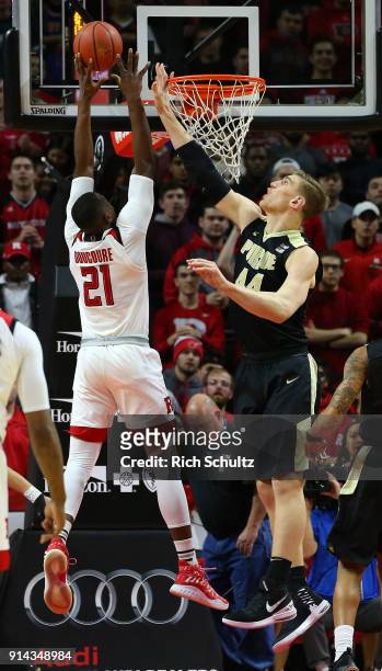 Mamadou Doucoure of the Rutgers Scarlet Knights attempts a shot as Isaac Haas of the Purdue Boilermakers defends during a game at Rutgers Athletic...