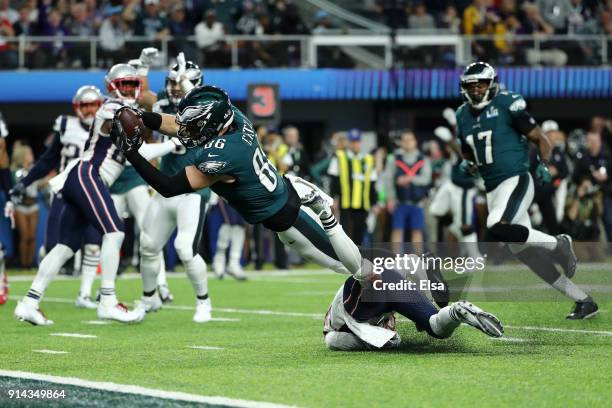 Zach Ertz of the Philadelphia Eagles dives into the endzone for a 11-yard touchdown against the New England Patriots during the fourth quarter in...