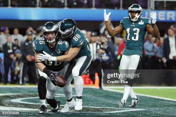 Zach Ertz of the Philadelphia Eagles celebrates his 11-yard touchdown catch with teammates Trey Burton and Nelson Agholor during the fourth quarter...