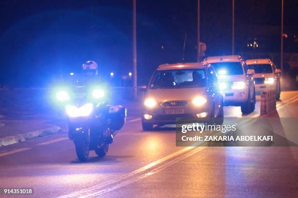 French police officers escort a convoy understood to be transporting Salah Abdeslam, the prime suspect in the November 2015 Paris attacks, from...