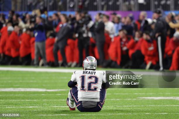 Tom Brady of the New England Patriots reacts after fumbling the ball during the fourth quarter against the Philadelphia Eagles in Super Bowl LII at...