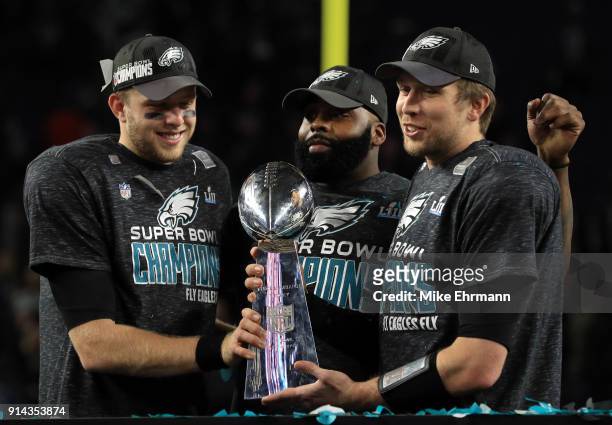 Malcolm Jenkins of the Philadelphia Eagles and Nick Foles of the Philadelphia Eagles hold the Lombardi Trophy after defeating the New England...