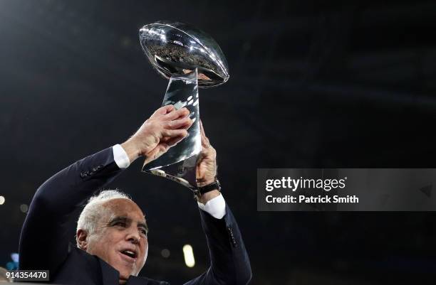 Owner Jeffrey Lurie of the Philadelphia Eagles raises the Vince Lombardi Trophy after they defeated the New England Patriots 41-33 in Super Bowl LII...