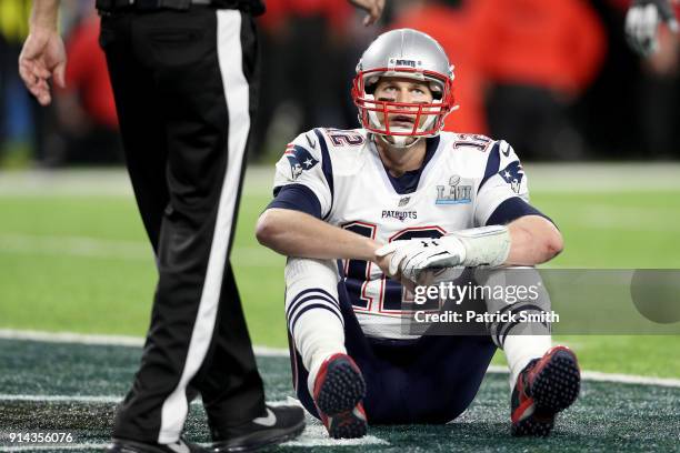 Tom Brady of the New England Patriots reacts after fumbling against the Philadelphia Eagles during the fourth quarter in Super Bowl LII at U.S. Bank...