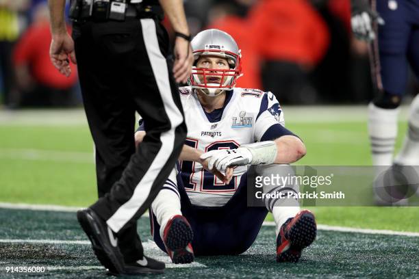 Tom Brady of the New England Patriots reacts after fumbling against the Philadelphia Eagles during the fourth quarter in Super Bowl LII at U.S. Bank...
