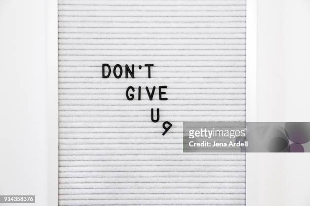 unmotivated and lazy letterboard that says don't give up - couch potato expressão em inglês - fotografias e filmes do acervo