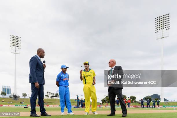 Presenter Ian Bishop, captain Prithvi Shaw of India, captain Jason Sangha of Australia and match referee Jeffrey Crowe take part in the coin toss...