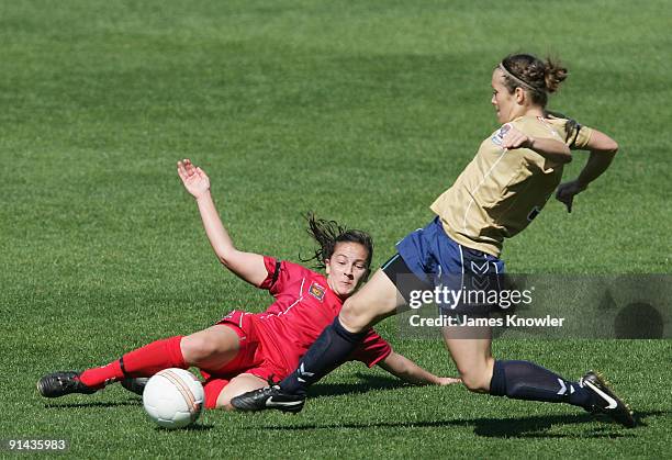 Pelay Ingles of United and Angela Fimmano of the Jets dive for the ball during the round one W-League match between Adelaide United and the Newcastle...