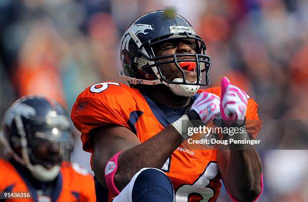 Linebacker Robert Ayers of the Denver Broncos celebrates a defensive play against the Dallas Cowboys during NFL action at Invesco Field at Mile High...