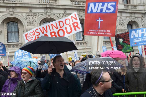 Protesters seen shouting slogans while holding several placards and posters during the demonstration. Thousand of people marched in London in a...