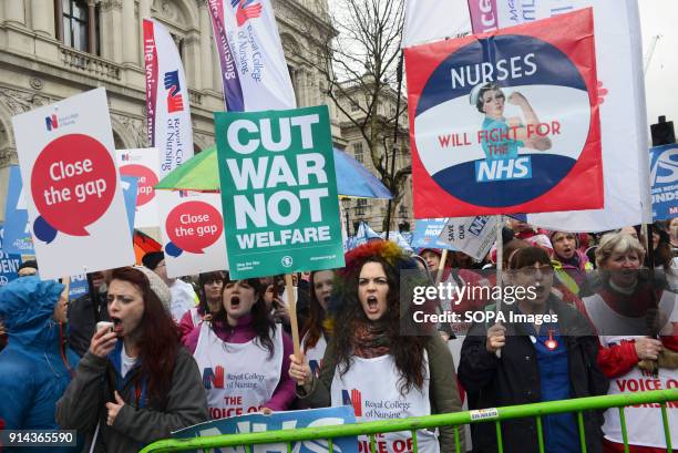 Protesters seen shouting slogans while holding several placards and posters during the demonstration. Thousand of people marched in London in a...