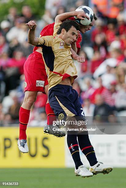 Kristian Sarkies of United and Labinot Haliti of the Jets head the ball during the round nine A-League match between Adelaide united and the...