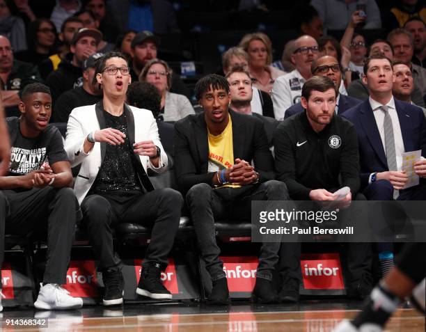 Jeremy Lin of the Brooklyn Nets, who is out for the season after having knee surgery, sits next to Rondae Hollis-Jefferson of the Nets, who did not...