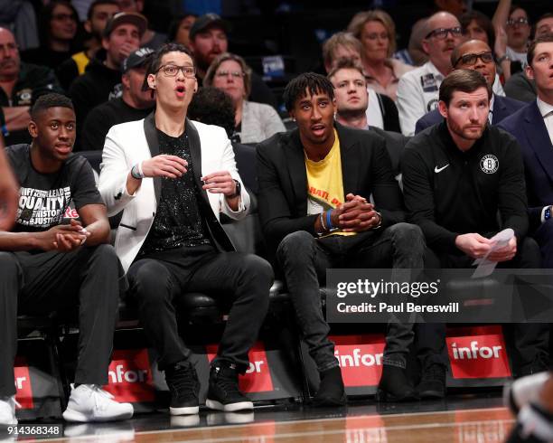 Jeremy Lin of the Brooklyn Nets, who is out for the season after having knee surgery, sits next to Rondae Hollis-Jefferson of the Nets, who did not...