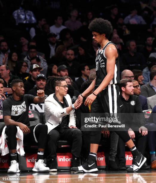 Jeremy Lin of the Brooklyn Nets greets teammat Jarrett Allen as Allen returns to the bench after playing in the 2nd quarter while Lin watches the...