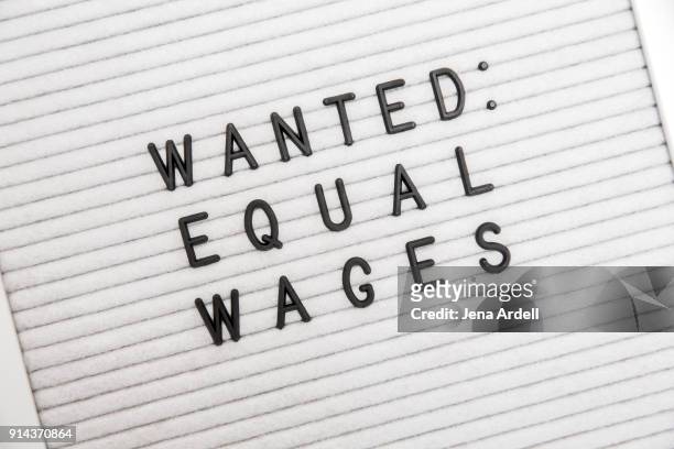 equal wage equal pay equality letterboard - equal pay day stock pictures, royalty-free photos & images