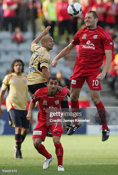 Adam Hughes of United heads the ball during the round nine A-League match between Adelaide united and the Newcastle Jets at Hindmarsh Stadium on...