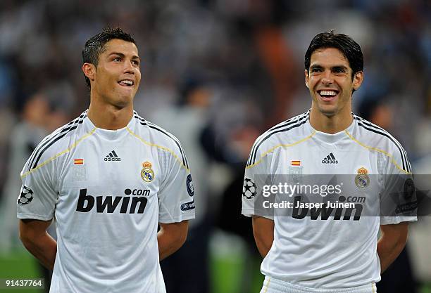 Cristiano Ronaldo and Kaka of Real Madrid share a light moment prior to the Champions League group C match between Real Madrid and Marseille at the...