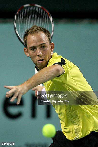 Dudi Sela of Israel returns a shot in his match against Marco Chiudinelli of Switzerland during day one of the Rakuten Open Tennis tournament at...