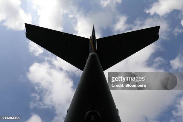 Tail fin of a U.S. Air Force C-17 Globemaster III aircraft, manufactured by Boeing Co., stands on display at the Singapore Airshow held at the Changi...