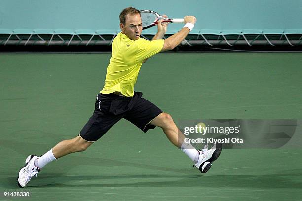 Dudi Sela of Israel returns a shot in his match against Marco Chiudinelli of Switzerland during day one of the Rakuten Open Tennis tournament at...