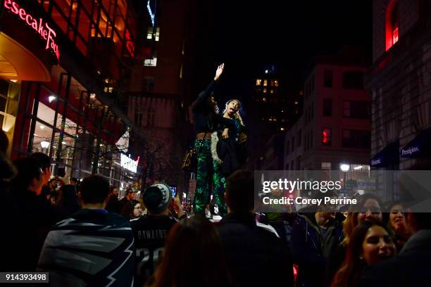 Fan reacts to the Eagles Super Bowl LII win, by dancing on an SUV on Walnut Street near City Hall on February 4, 2018 in downtown Philadelphia,...