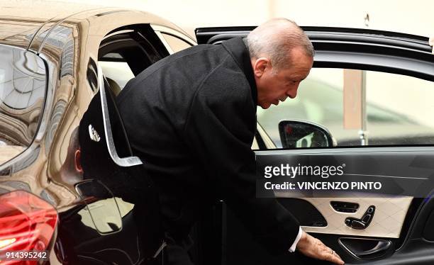 Turkey's President Recep Tayyip Erdogan steps out of a vehicle as he arrives at San Damaso courtyard prior to meet with the Pope at the Vatican on...