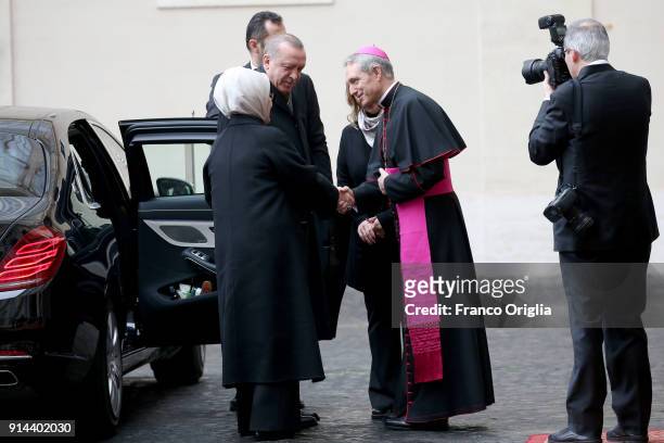 President of Turkey Recep Tayyip Erdogan and wife Ermiine Erdogan are welcomed by the prefect of the papal household Georg Gaenswein as they arrive...