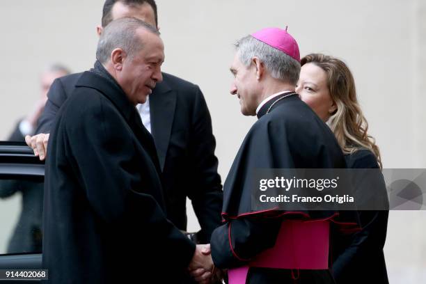 President of Turkey Recep Tayyip Erdogan is welcomed by the prefect of the papal household Georg Gaenswein as he arrives at the Apostolic Palace for...