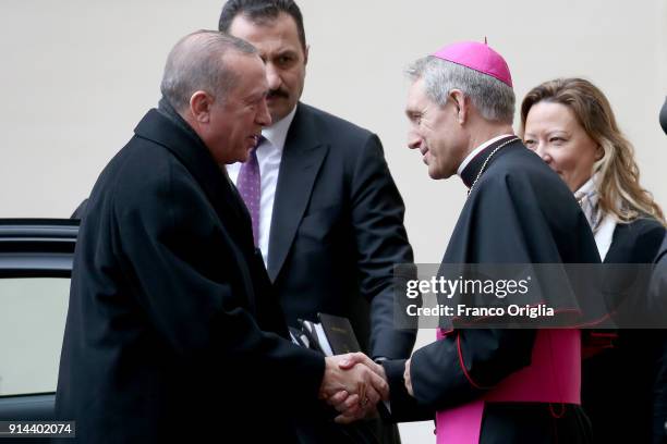 President of Turkey Recep Tayyip Erdogan is welcomed by the prefect of the papal household Georg Gaenswein as he arrives at the Apostolic Palace for...
