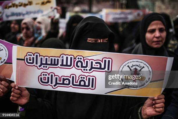 Palestinians holding posters and banners gather for a demonstration to show their support for the Palestinian prisoners in Israeli jails, in front of...