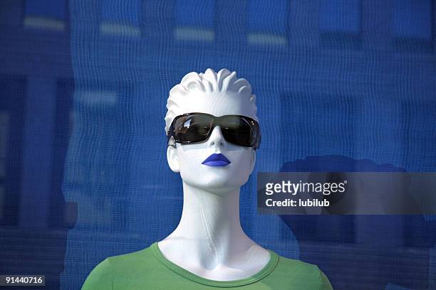 dummy or mannequin in the window of a fashion store - mannequin blonde stockfoto's en -beelden