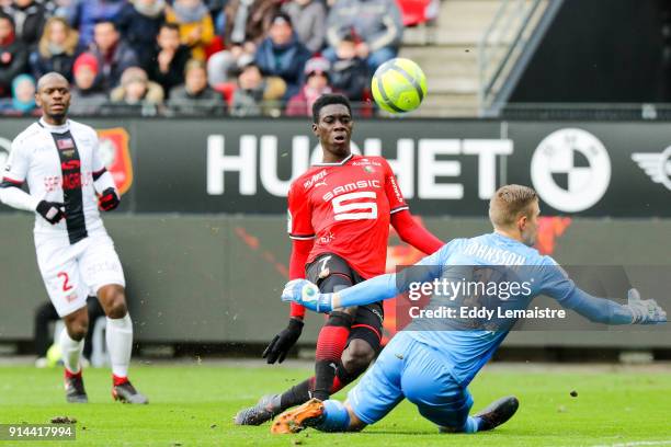 Ismaila Sarr of Rennes and Karl Johan Jonhsson, Goalkeeper of Guingamp during the Ligue 1 match between Rennes and EA Guingamp at Roazhon Park on...