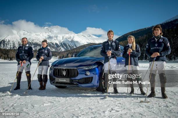 Hissam al Hyder, Zhanna Bandurko Gerardo Mazzini, Raya Sidorenko and Robert Strom of team Maserati pose near a Maserati Levante during Snow Polo...