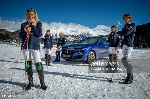 Raya Sidorenko, Zhanna Bandurko, Hissam al Hyder, Robert Strom and Gerardo Mazzini of team Maserati pose near a Maserati Levante during Snow Polo...