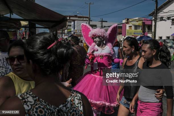 Hundreds of revelers accompany a block of carnival known as the Virgins of Olinda, where men traditionally dress in women's clothing during a...