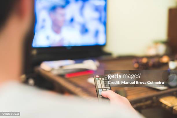 watching tv - tv audience stock pictures, royalty-free photos & images