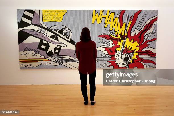 Gallery assistant views the restored artwork Whaam! by Roy Lichtenstein in Tate Liverpool on February 5, 2018 in London, England. Lichtenstein's...