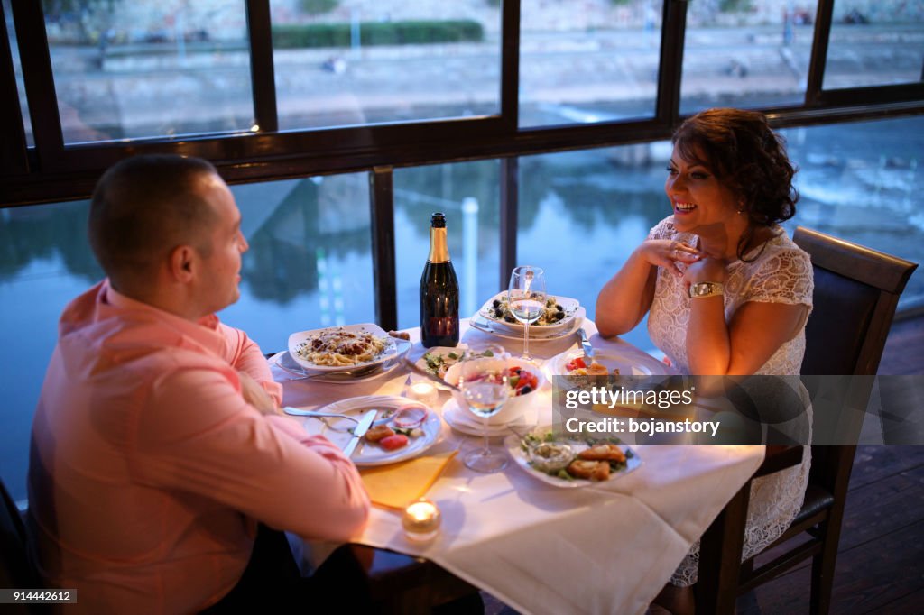 Young couple enjoying romantic dinner