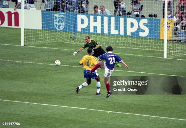 Christophe Dugarry of France and Junior Baiano and Claudio Taffarel of Brazil during the Soccer World Cup Final between Brazil and France on July 12...