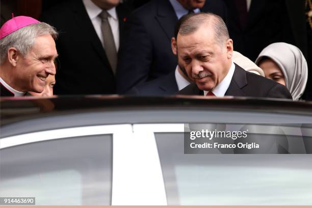 Prefect of the papal household Georg Gaenswein greets President of Turkey Recep Tayyip Erdogan as he leaves the Apostolic Palace after an audience...