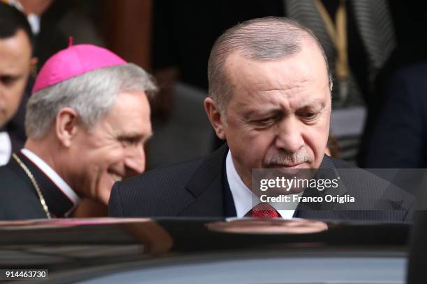 Prefect of the papal household Georg Gaenswein greets President of Turkey Recep Tayyip Erdogan as he leaves the Apostolic Palace after an audience...