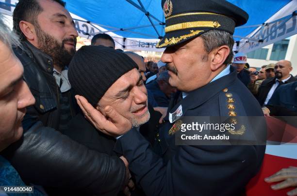 Police chief Murat Kolcu tries to give solace to father of martyred specialist corporal Halil Ibrahim Aygul, who was martyred after the terrorist...